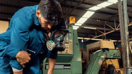Skillful factory worker rescue his teammate out of poisonous gas leakage . Industry and engineering people accident and safety concept .の写真素材