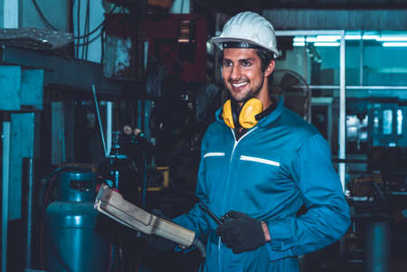 Smart factory worker or engineer do machine job in manufacturing workshop . Industry and engineering concept .の写真素材