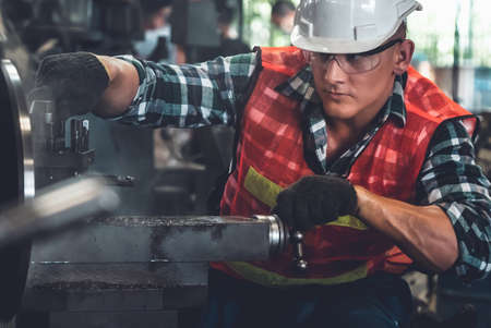 Smart factory worker or engineer do machine job in a manufacturing workshop . Industry and engineering concept .の写真素材