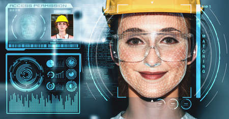 Facial recognition technology for industry worker to access machine control . Future concept interface showing digital biometric security system that analyze human face to verify personal data .の写真素材