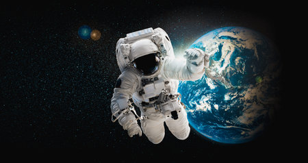 Astronaut spaceman do spacewalk while working for space station in outer space . Astronaut wear full...