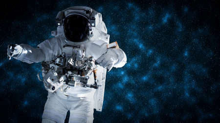 Astronaut spaceman do spacewalk while working for space station in outer space . Astronaut wear full spacesuit for space operation .の写真素材