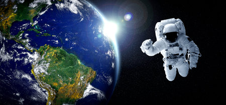 Astronaut spaceman do spacewalk while working for space station in outer space . Astronaut wear full spacesuit for space operation .の写真素材