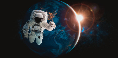 Astronaut spaceman do spacewalk while working for space station in outer space . Astronaut wear full...