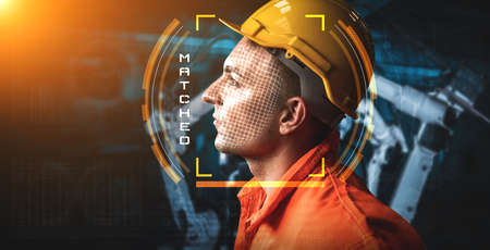 Facial recognition technology for industry worker to access machine control . Future concept interface showing digital biometric security system that analyze human face to verify personal data .の写真素材