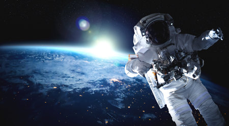 Astronaut spaceman do spacewalk while working for space station in outer space . Astronaut wear full...