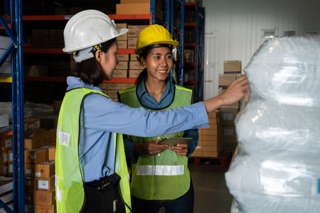 Female warehouse worker working at the storehouse . Logistics , supply chain and warehouse business...