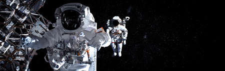 Astronaut spaceman do spacewalk while working for space station in outer space . Astronaut wear full spacesuit for space operation .の写真素材