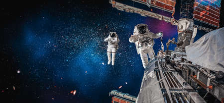 Astronaut spaceman do spacewalk while working for space station in outer space . Astronaut wear full spacesuit for space operation .の写真素材