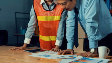 Warehouse manager and worker working in the storehouse . Logistics , supply chain and warehouse business concept .の写真素材