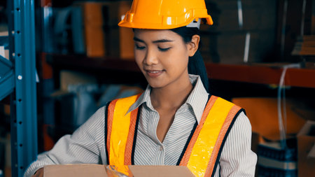 Female warehouse worker working at the storehouse . Logistics , supply chain and warehouse business...