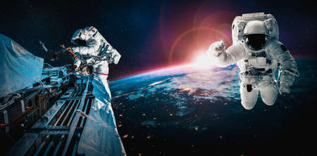 Astronaut spaceman do spacewalk while working for space station in outer space . Astronaut wear full spacesuit for space operation .の写真素材