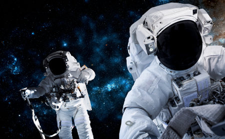 Astronaut spaceman do spacewalk while working for space station in outer space . Astronaut wear full spacesuit for space operation .の写真素材