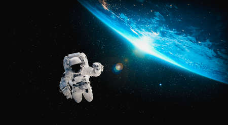 Astronaut spaceman do spacewalk while working for space station in outer space . Astronaut wear full spacesuit for space operation .の写真素材