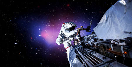 Astronaut spaceman do spacewalk while working for space station in outer space . Astronaut wear full spacesuit for space operation .の写真素材