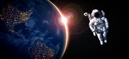 Astronaut spaceman do spacewalk while working for space station in outer space . Astronaut wear full spacesuit for space operation . Elements of this image furnished by  space astronaut photos.の写真素材