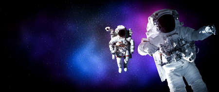 Astronaut spaceman do spacewalk while working for space station in outer space . Astronaut wear full spacesuit for space operationの写真素材