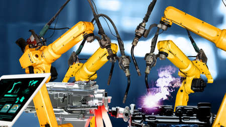 Smart industry robot arms modernization for innovative factory technology . Concept of automation manufacturing process of Industry 4.0 or 4th industrial revolution and IOT software control operation.の写真素材