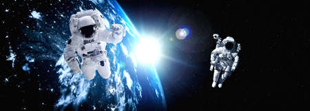 Astronaut spaceman do spacewalk while working for space station in outer space . Astronaut wear full spacesuit for space operation . Elements of this image furnished by NASA space astronaut photos.の写真素材