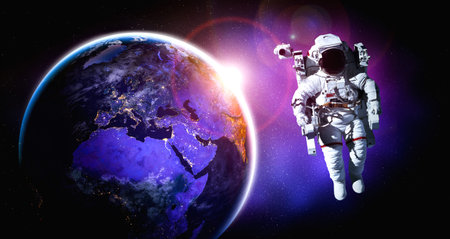 Astronaut spaceman do spacewalk while working for space station in outer space . Astronaut wear full...