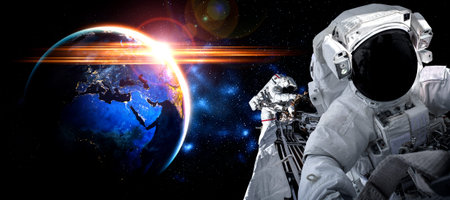 Astronaut spaceman do spacewalk while working for space station in outer space .