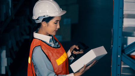 Female warehouse worker working at the storehouse . Logistics , supply chain and warehouse business...