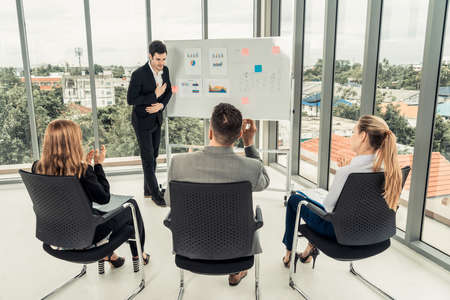 Businesswomen and businessmen attending group meeting conference in office room. Corporate business team concept.の写真素材