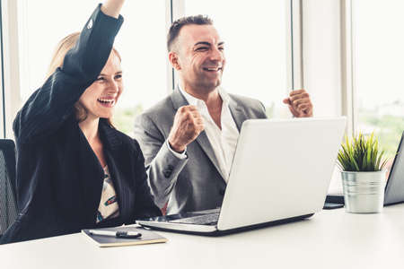 Businessman executive is in meeting discussion with a businesswoman worker in modern workplace office. People corporate business team concept.の写真素材