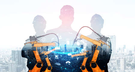 Mechanized industry robot arm and factory worker double exposure . Concept of robotics technology for industrial revolution and automated manufacturing process .の写真素材