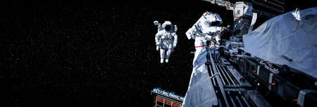 Astronaut spaceman do spacewalk while working for space station in outer space . Astronaut wear full spacesuit for space operationの写真素材