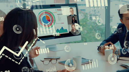 Creative visual of business people in a corporate staff meeting on video call . Concept of digital technology for marketing data analysis and investment decision making .の写真素材