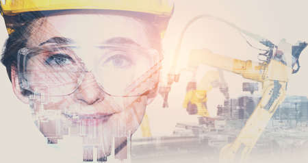 Mechanized industry robot arm and factory worker double exposure . Concept of robotics technology for industrial revolution and automated manufacturing process .の写真素材