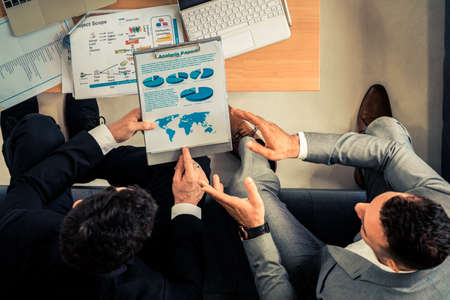 Businessman is in meeting discussion with another businessman partner in modern workplace office. People corporate business team concept.の写真素材