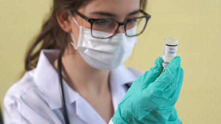 Skillful doctor prepare vaccine proficiently before injection . Covid 19 and coronavirus vaccination...