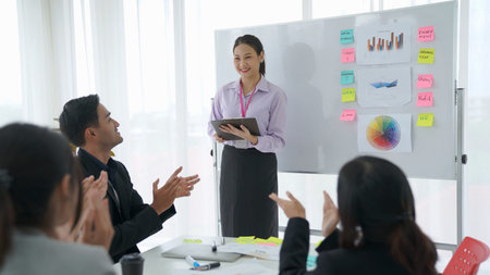 Businesswoman proficiently present work project receive celebrations from team . Corporate business...