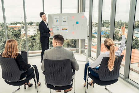 Businesswomen and businessmen attending group meeting conference in office room. Corporate business team concept.の写真素材