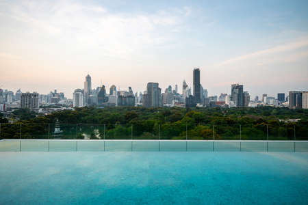 Cityscape and high-rise buildings in metropolis city with water reflection in the early morning .の写真素材