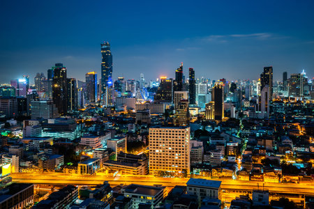 Night cityscape and high-rise buildings in metropolis city center . Downtown business district in panoramic view .の写真素材