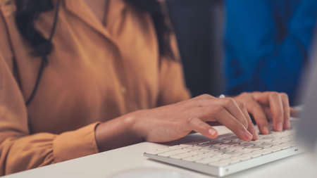 Close up shot of business people hand typing and working actively . Call center, telemarketing,...