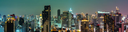 Night cityscape and high-rise buildings in metropolis city center . Downtown business district in...