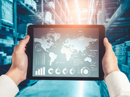 Warehouse management innovative software in computer for real time monitoring of goods package delivery . Computer screen showing smart inventory dashboard for storage and supply chain distribution .の写真素材