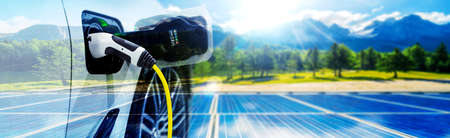 EV charging station for electric car in concept of green sustainable energy produced from renewable resources to supply to charger station in order to reduce CO2 emission .の写真素材