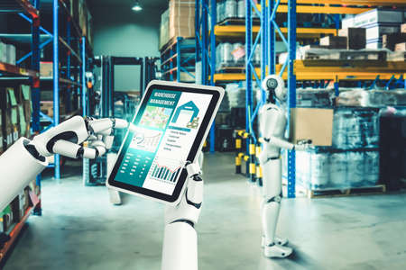 Innovative industry robot working in warehouse for human labor replacement . Concept of artificial intelligence for industrial revolution and automation manufacturing process .の写真素材