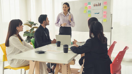 Business project presentation by proficiently skilled businesswoman team leader . Corporate business team collaboration concept .の写真素材