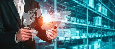 Smart warehouse management system with innovative internet of things technology to identify package picking and delivery . Future concept of supply chain and logistic network business .の写真素材