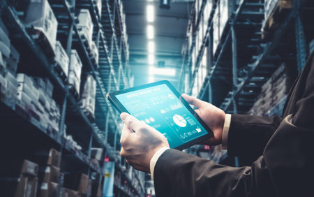 Warehouse management innovative software in computer for real time monitoring of goods package delivery . Computer screen showing smart inventory dashboard for storage and supply chain distribution .の写真素材