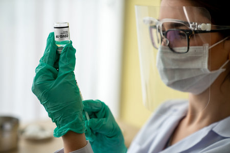 Skillful doctor prepare vaccine proficiently before injection . Covid 19 and coronavirus vaccination...