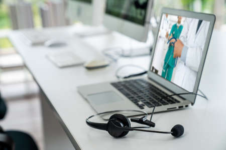 Telemedicine service online video call for doctor to actively chat with patient via remote healthcare consultant software . People can use app to contact doctors for virtual meeting from home .の写真素材