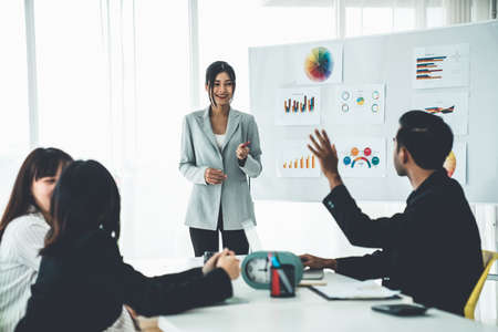 Business people proficiently discuss work project while sitting in circle . Corporate business team collaboration concept .の写真素材