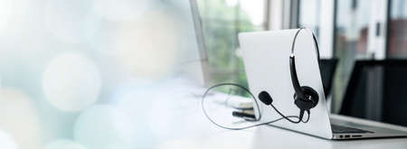 Headset and customer support equipment at call center ready for actively service . Corporate business help desk and telephone assistance concept .の写真素材